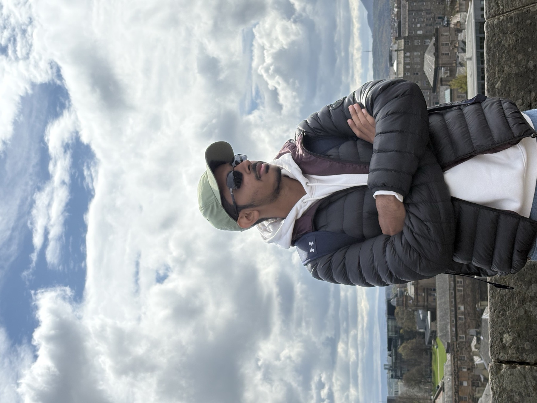 Hamza Bamboat overlooking Edinburgh under a dramatic sky