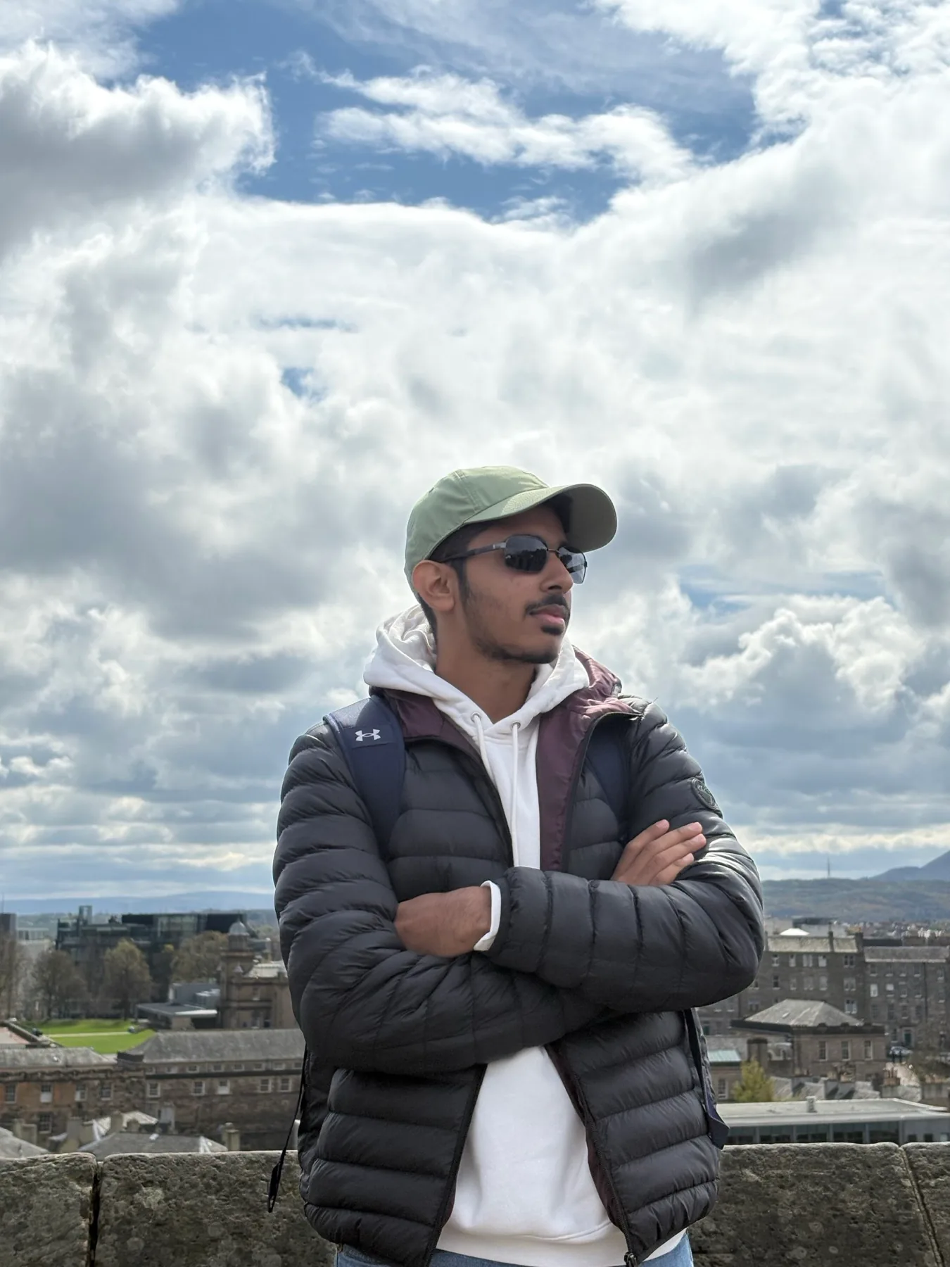 Hamza Bamboat overlooking Edinburgh under a dramatic sky