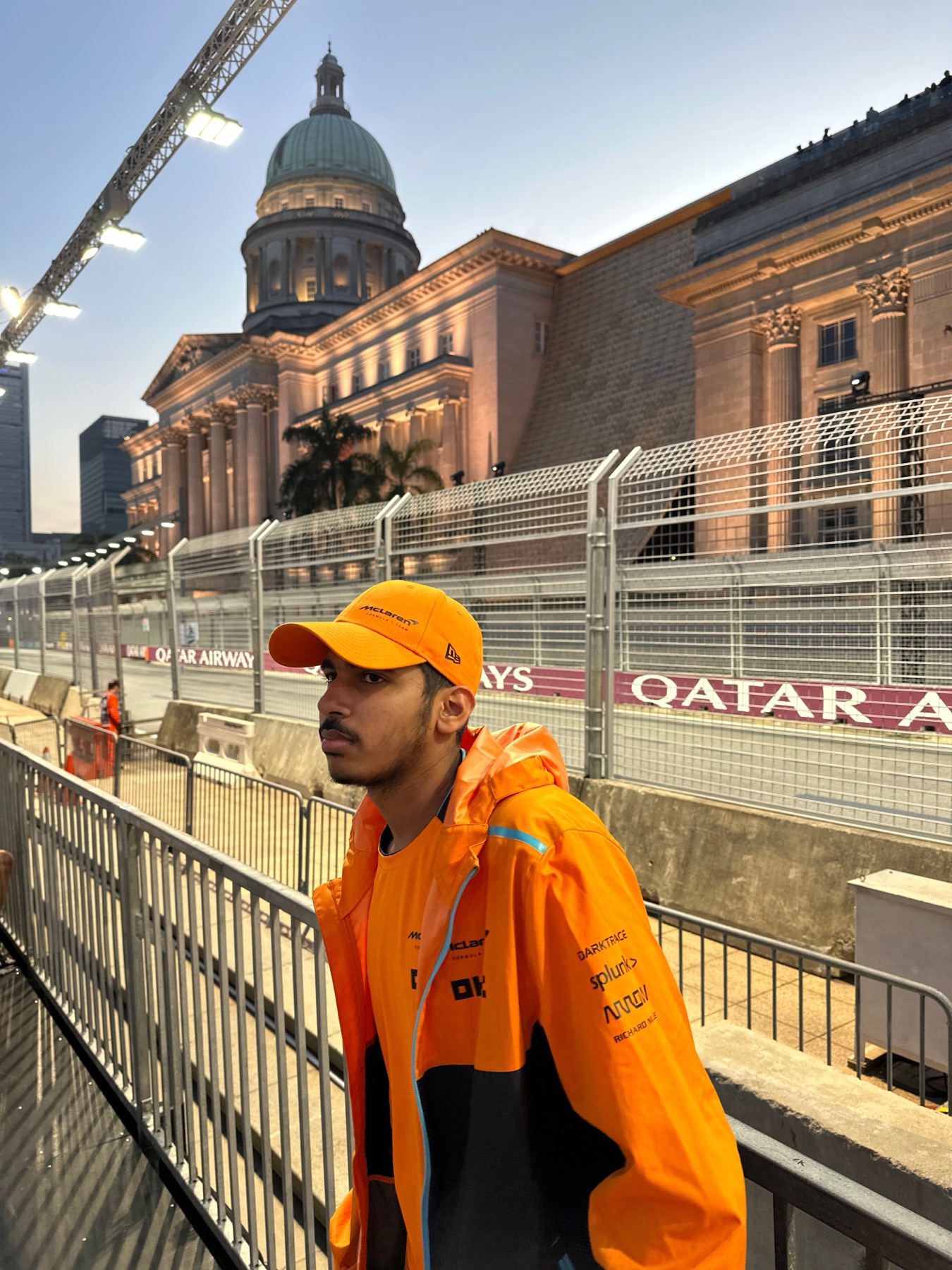 Hamza Bamboat in McLaren colours beside the Singapore Grand Prix circuit